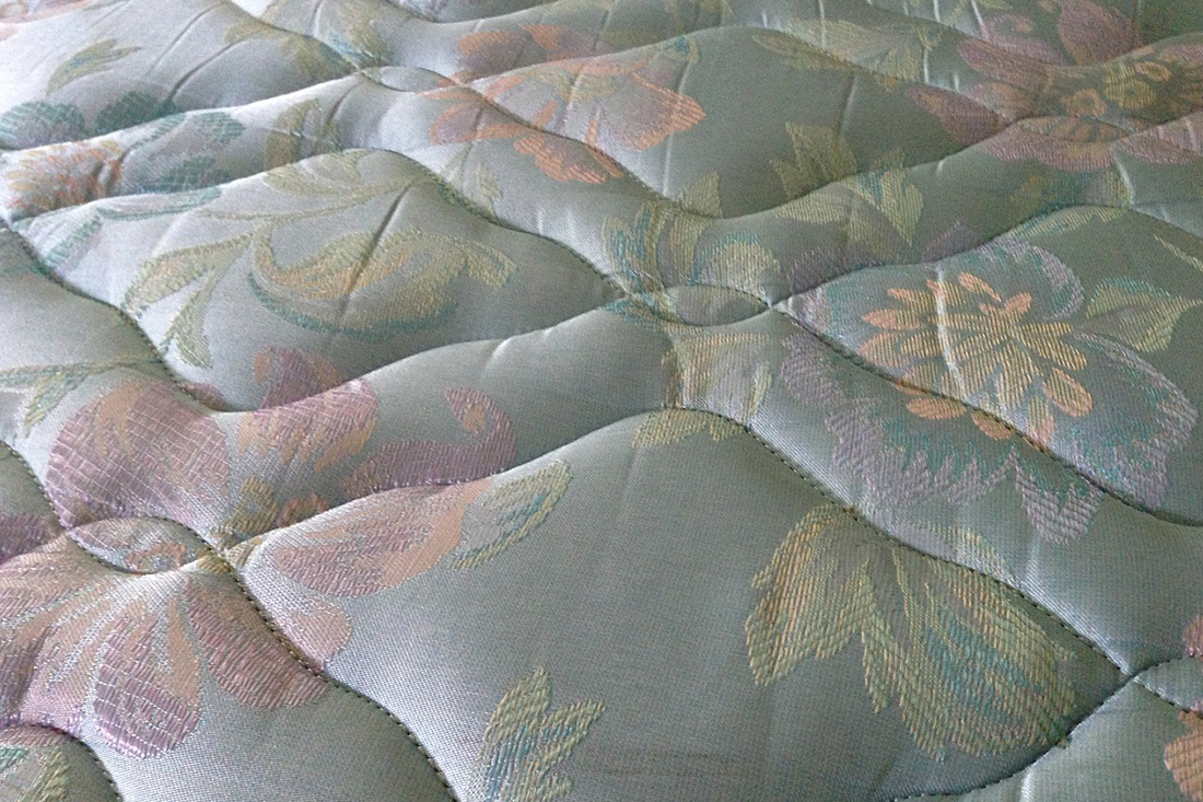 Storing mattresses horizontally will help maintain their integrity.